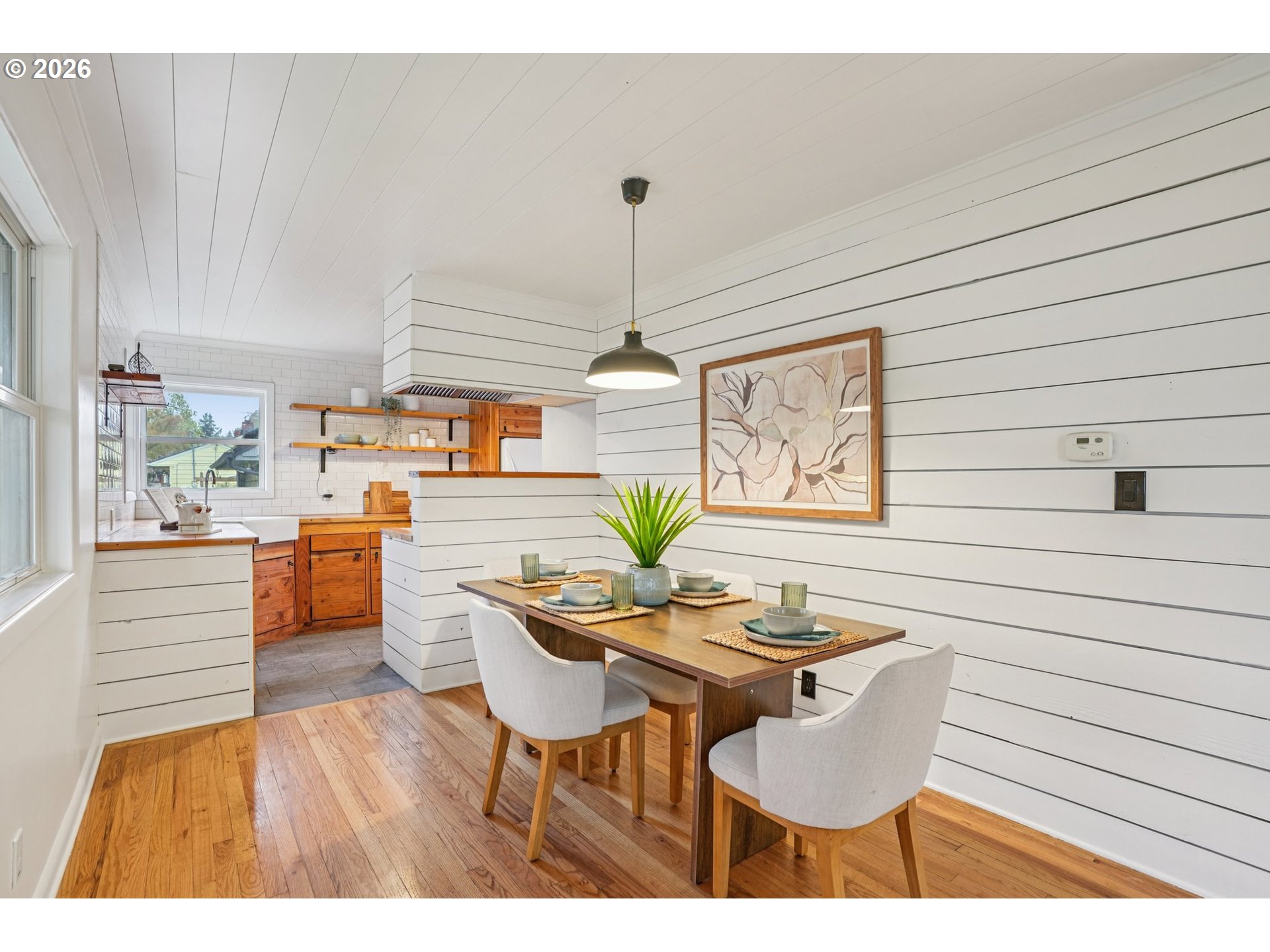 7921 Northeast Clackamas Street Portland, OR 97213 - Photo 9 of 31 a dining room with furniture a chandelier and wooden floor