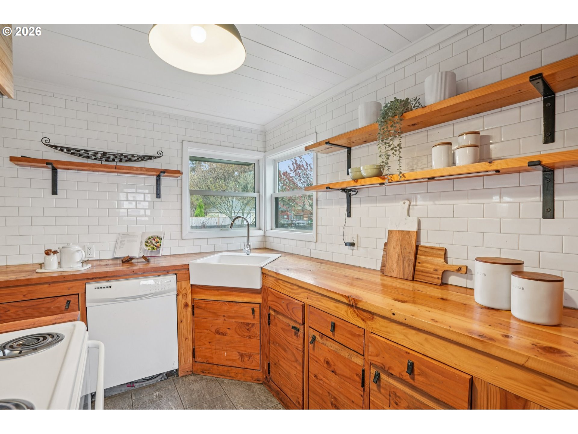 7921 Northeast Clackamas Street Portland, OR 97213 - Photo 10 of 31 a kitchen with a sink and cabinets