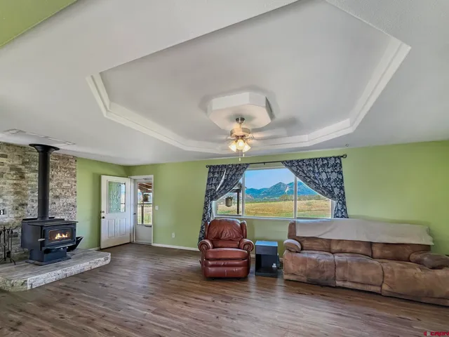 a bedroom with furniture and wooden floor
