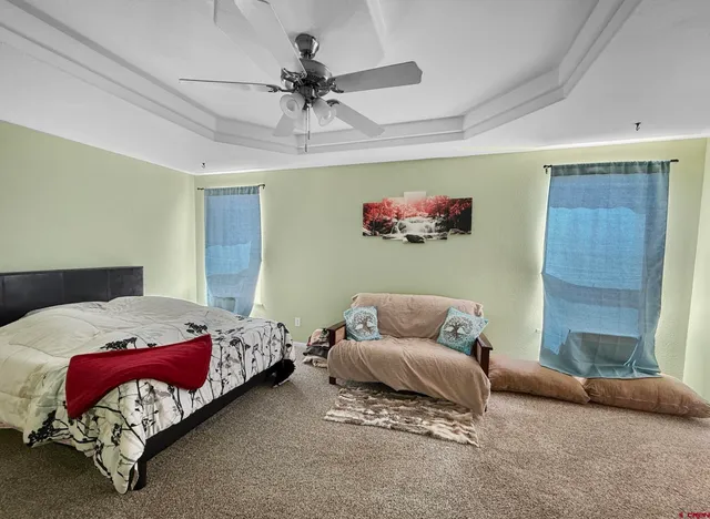 a bedroom with a bed and a couch