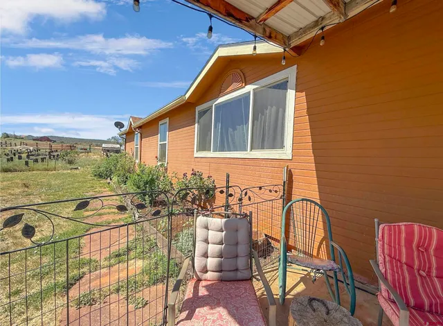 a backyard of a house with seating space