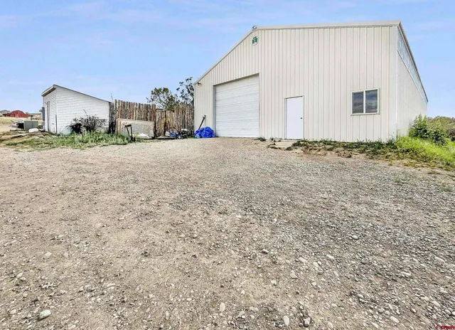 a view of garage and yard
