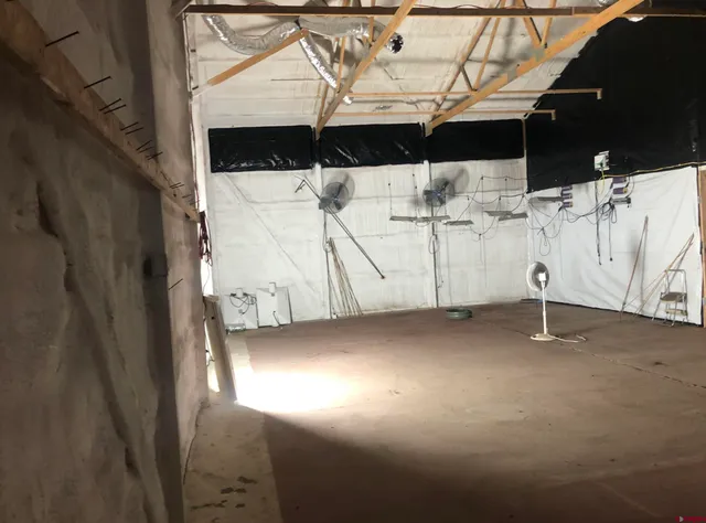 a view of a studio with wooden floor