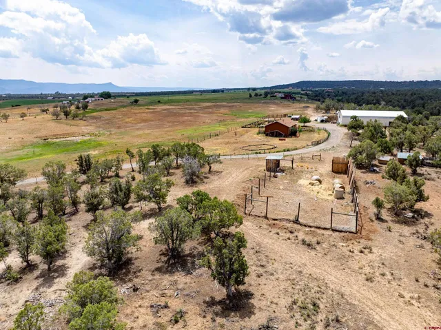 a view of a lake with houses in the back