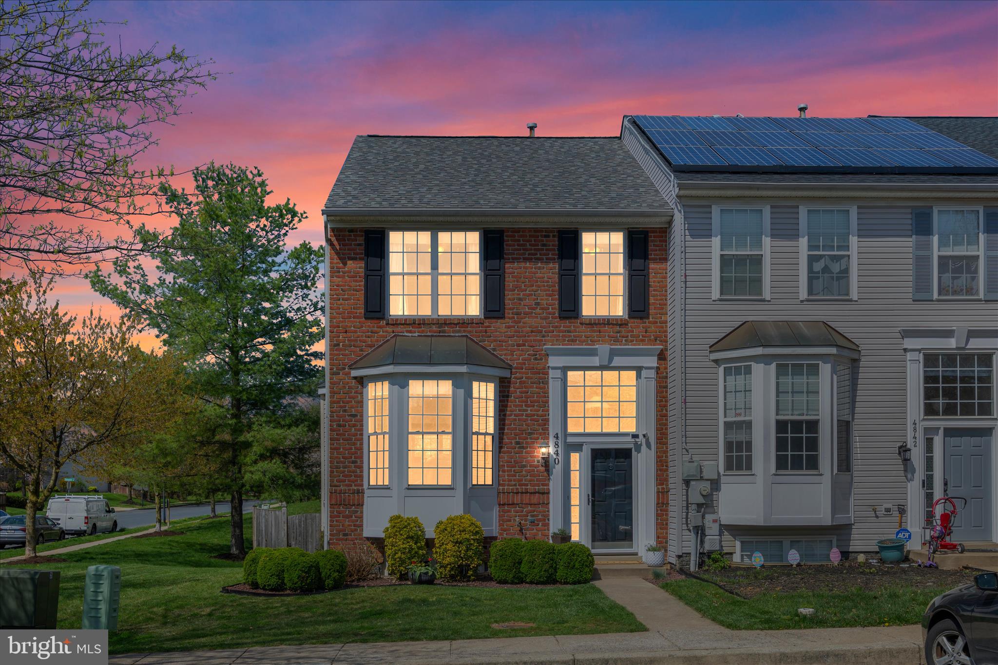 4840 Marsden Place Frederick, MD 21703 - Photo 2 of 46 front view of a brick house with a yard