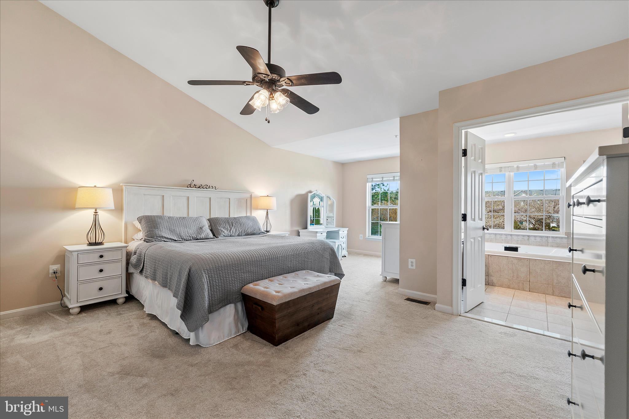 4840 Marsden Place Frederick, MD 21703 - Photo 25 of 46 a spacious bedroom with a bed and a chandelier