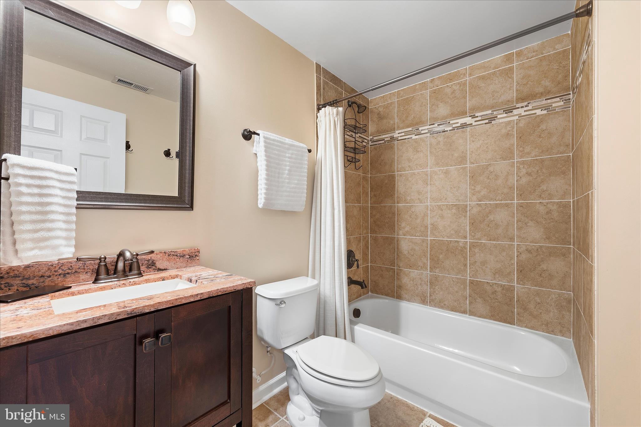 4840 Marsden Place Frederick, MD 21703 - Photo 33 of 46 a bathroom with a sink a toilet and shower