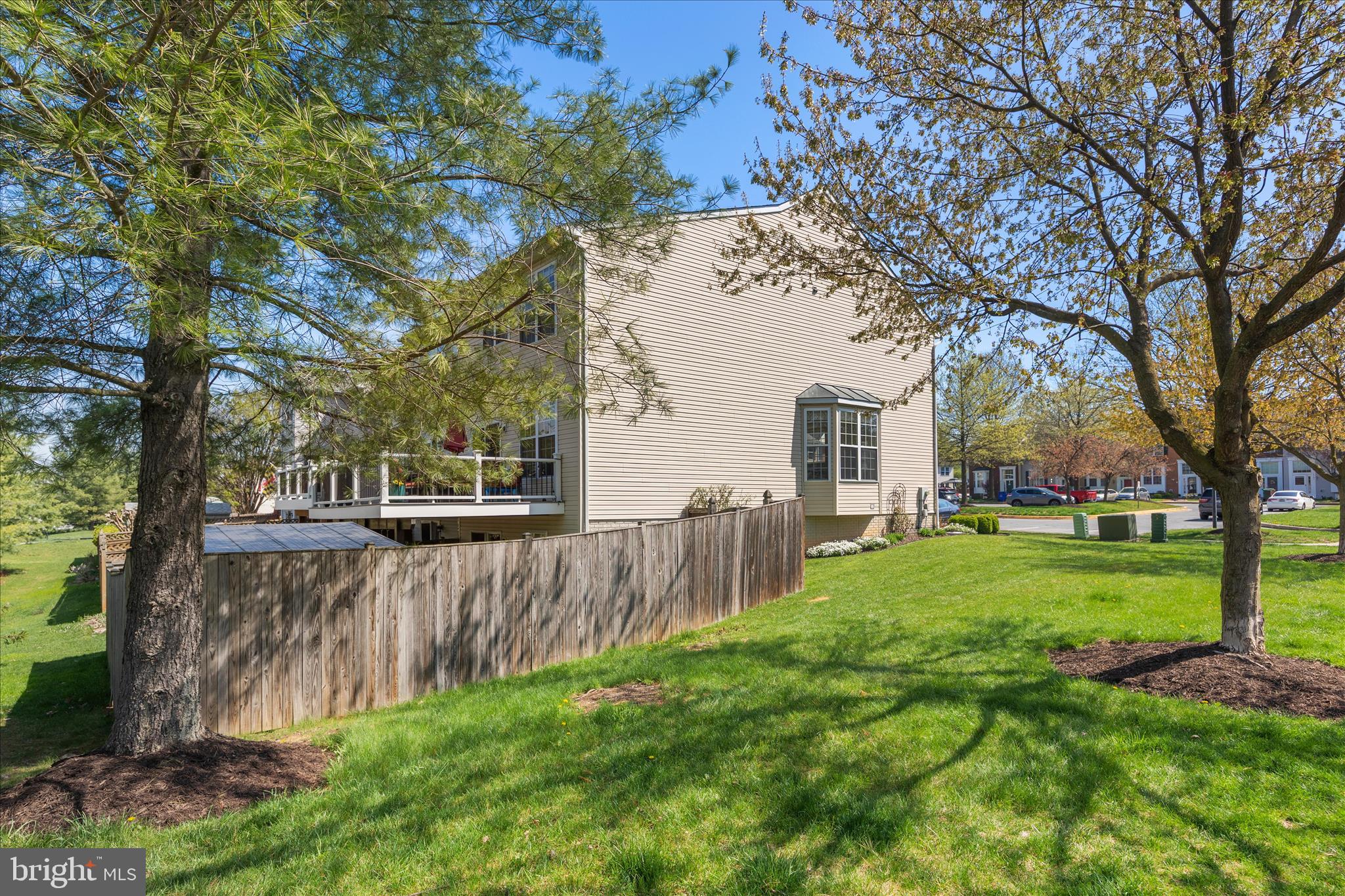 4840 Marsden Place Frederick, MD 21703 - Photo 45 of 46 a view of a backyard with wooden fence and large trees