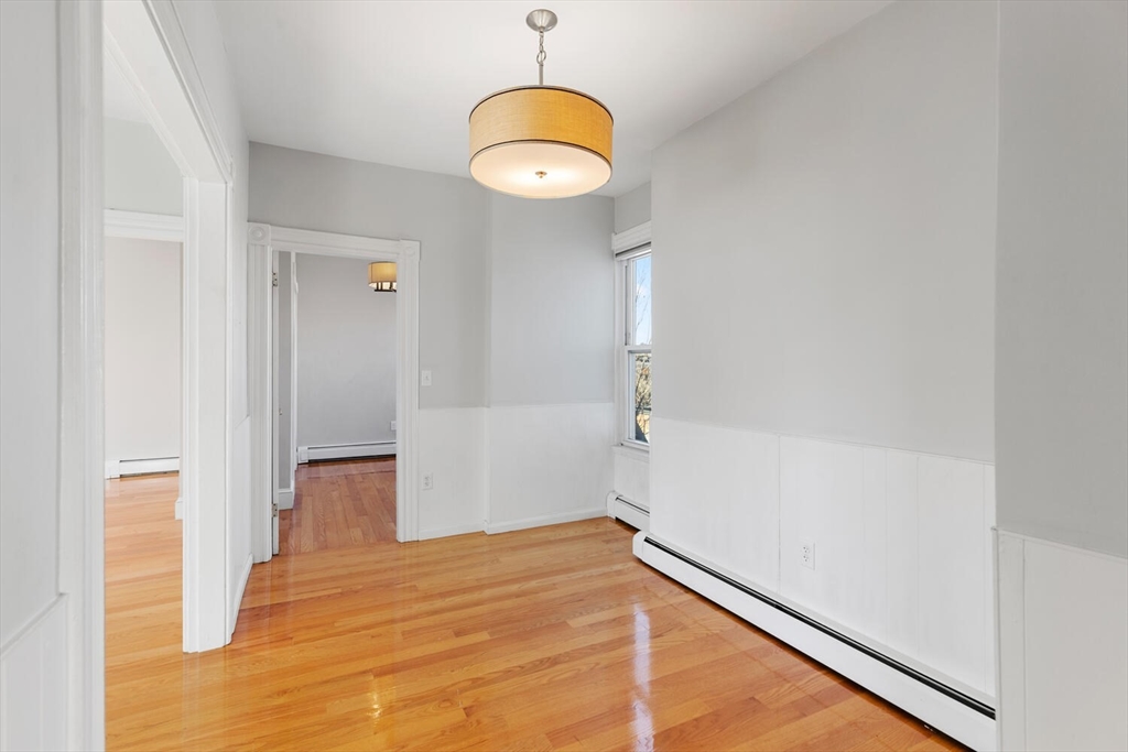 6-8 School Street Boston, MA 02129 - Photo 13 of 27 a view of empty room with wooden floor