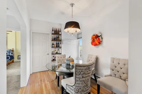 a view of a livingroom with furniture and a flat screen tv