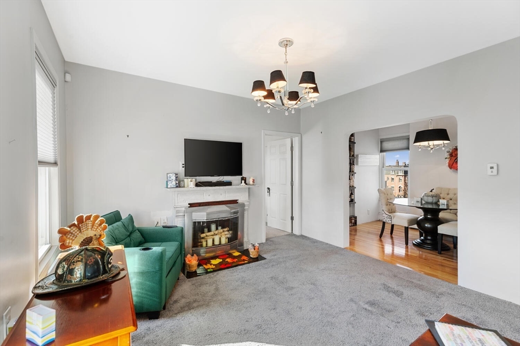 6-8 School Street Boston, MA 02129 - Photo 16 of 27 a view of a livingroom with furniture and a flat screen tv