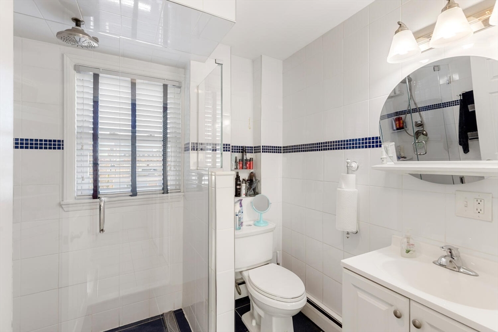 6-8 School Street Boston, MA 02129 - Photo 22 of 27 a bathroom with a sink a toilet and shower