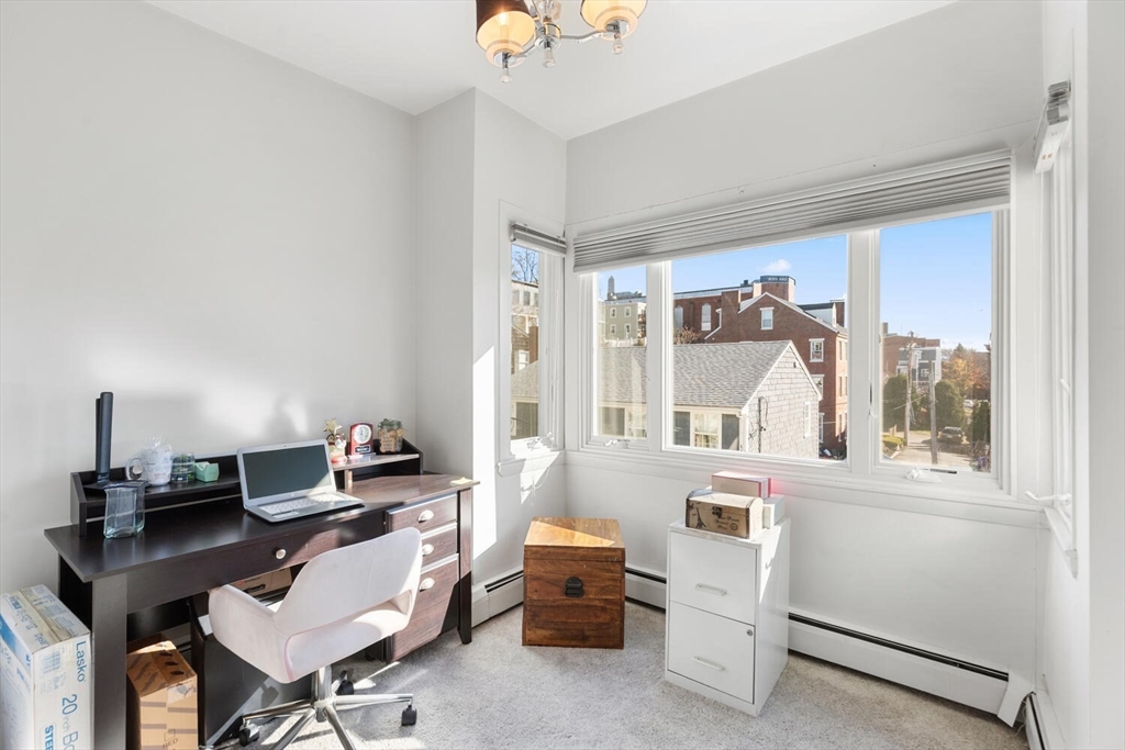 6-8 School Street Boston, MA 02129 - Photo 24 of 27 a workspace with furniture and a window