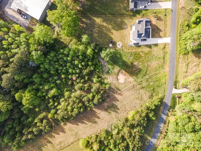 a bathroom with a small yard and green space
