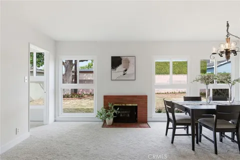 a view of a livingroom with furniture and a fireplace