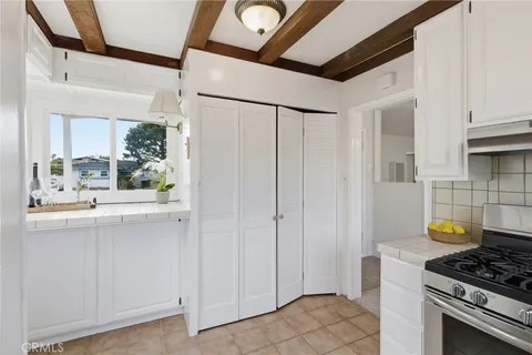a kitchen with stainless steel appliances granite countertop a stove and a refrigerator