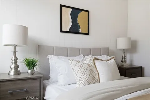 a bed room with a bed and a lamp