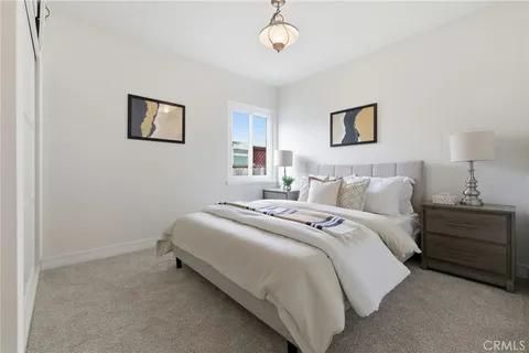 a bedroom with bed and a window