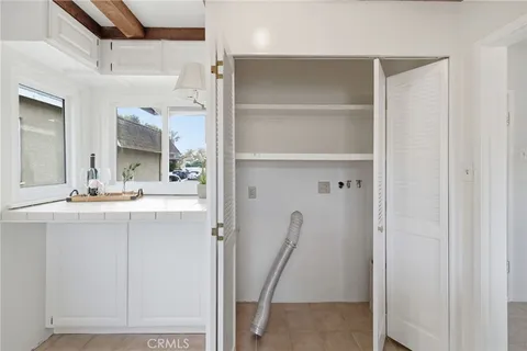 a bathroom with a sink a mirror and a shower