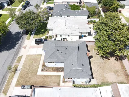 an aerial view of residential houses with city view