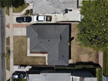 an aerial view of a house with a yard
