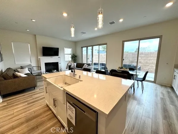 a large white kitchen with a large window