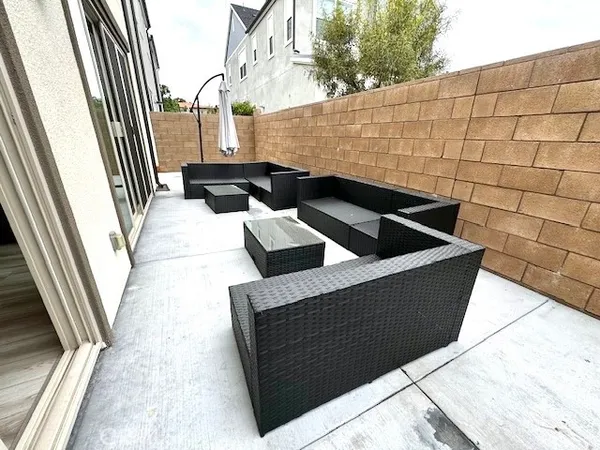 a view of balcony with two chairs and a table