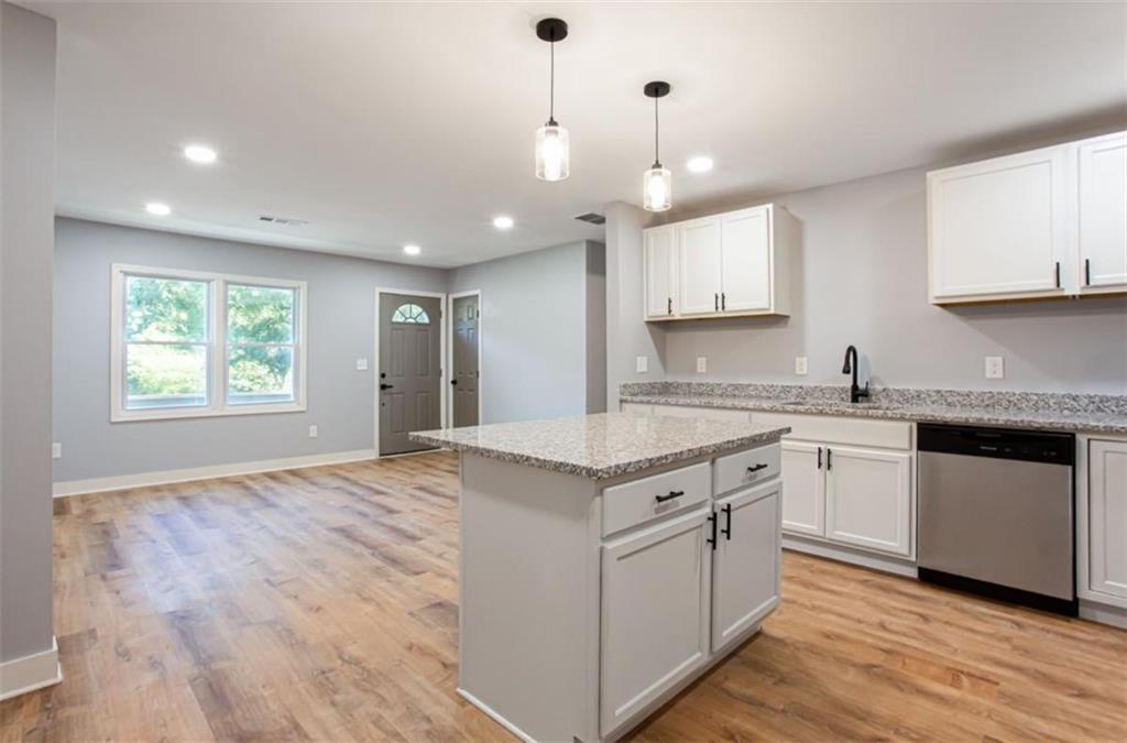 3652 Sweetbriar Circle Lithia Springs, GA 30122 - Photo 13 of 30 a kitchen with a stove sink and cabinets