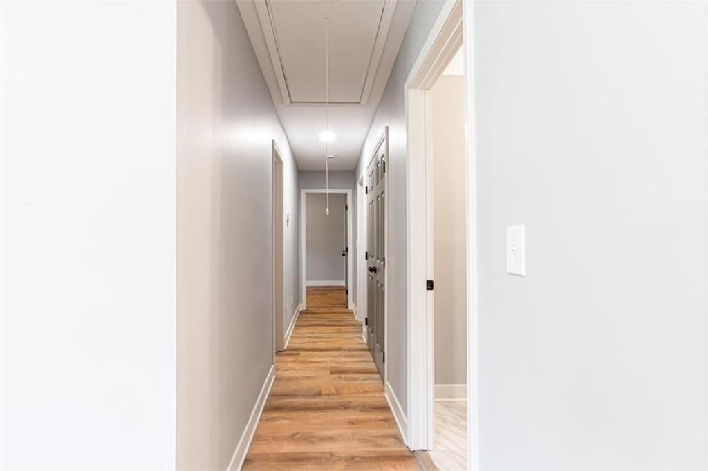 3652 Sweetbriar Circle Lithia Springs, GA 30122 - Photo 17 of 30 a view of a hallway with wooden floor