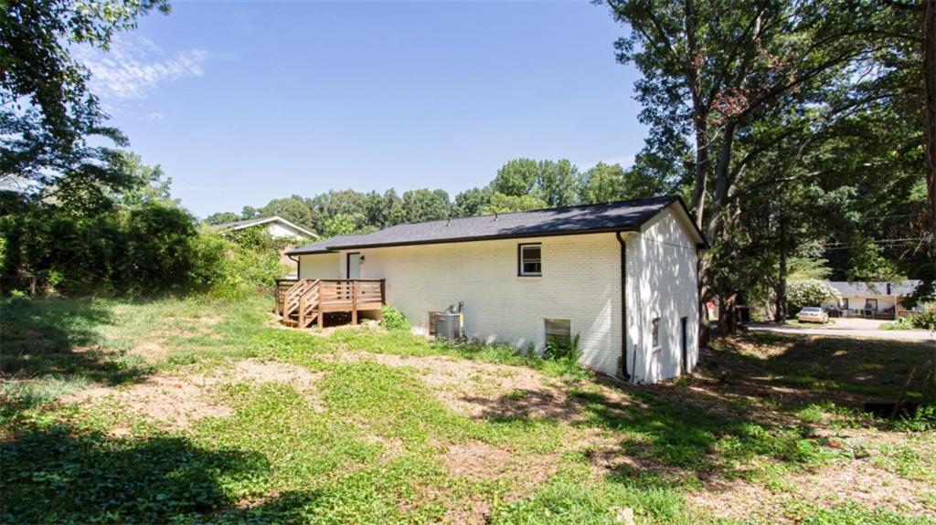 3652 Sweetbriar Circle Lithia Springs, GA 30122 - Photo 5 of 30 a backyard of a house with yard and outdoor seating