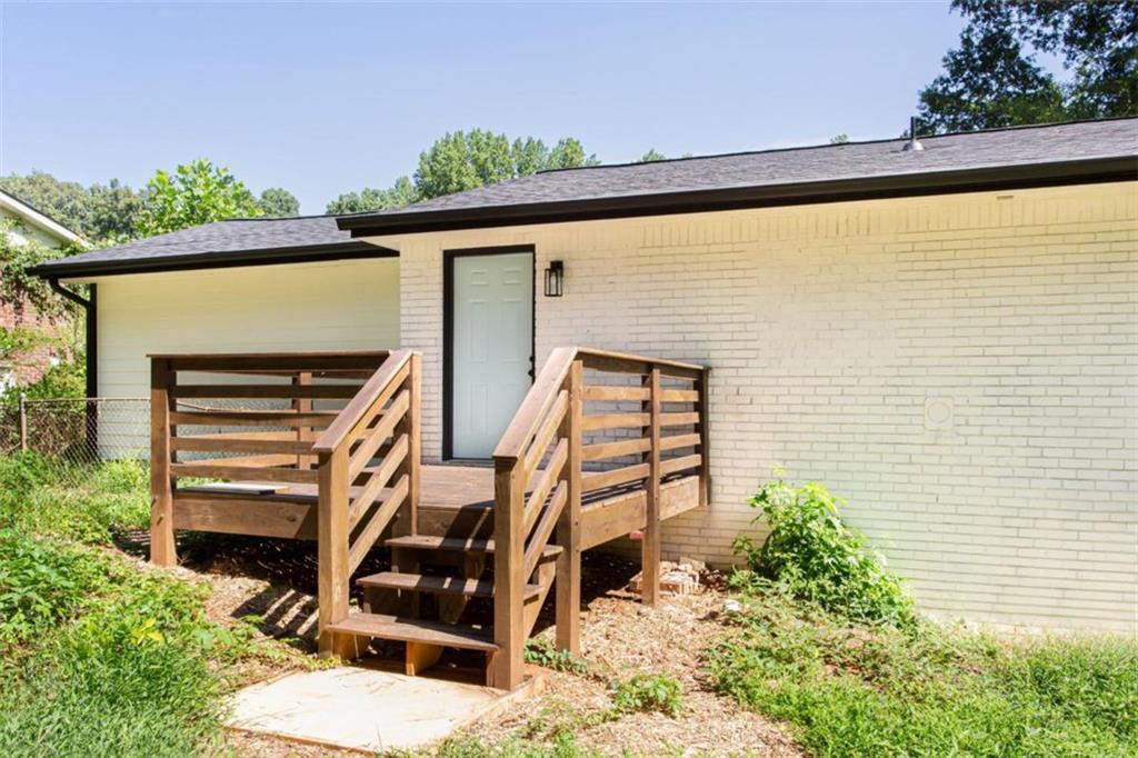 3652 Sweetbriar Circle Lithia Springs, GA 30122 - Photo 6 of 30 a backyard of a house with wooden stairs