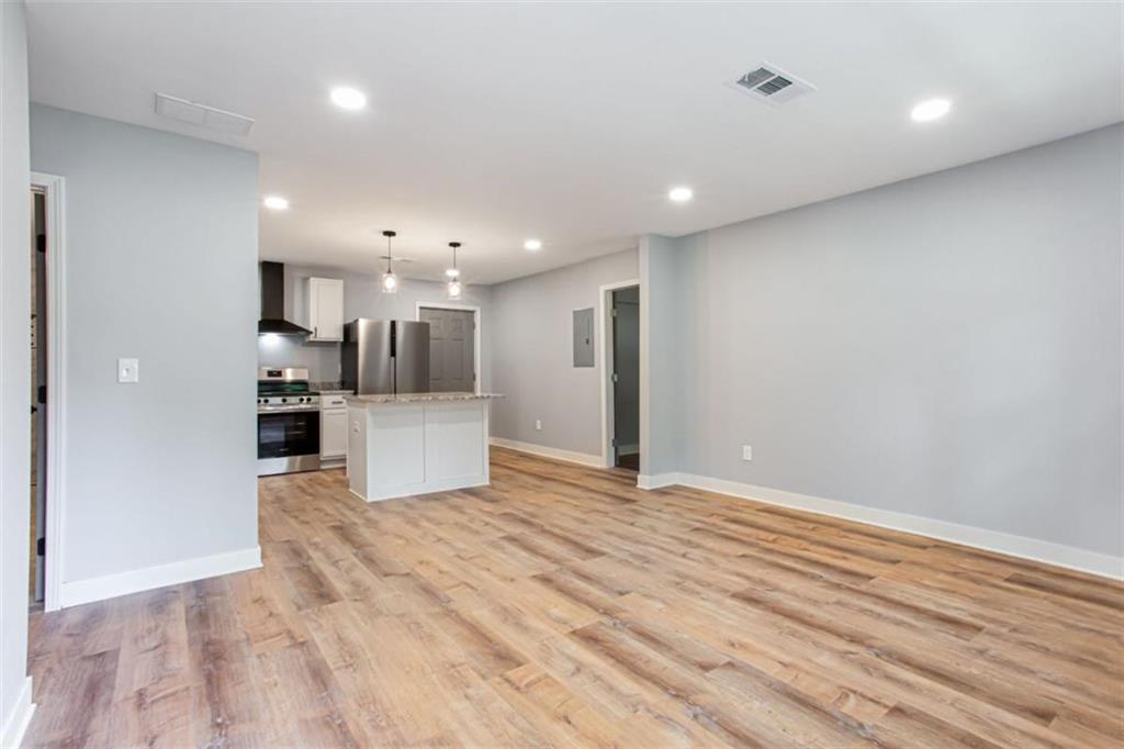 3652 Sweetbriar Circle Lithia Springs, GA 30122 - Photo 8 of 30 a view of a kitchen with a refrigerator and a stove top oven