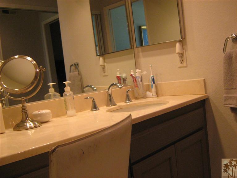 58 Majorca Drive Rancho Mirage, CA 92270 - Photo 15 of 22 a bathroom with a sink and a mirror