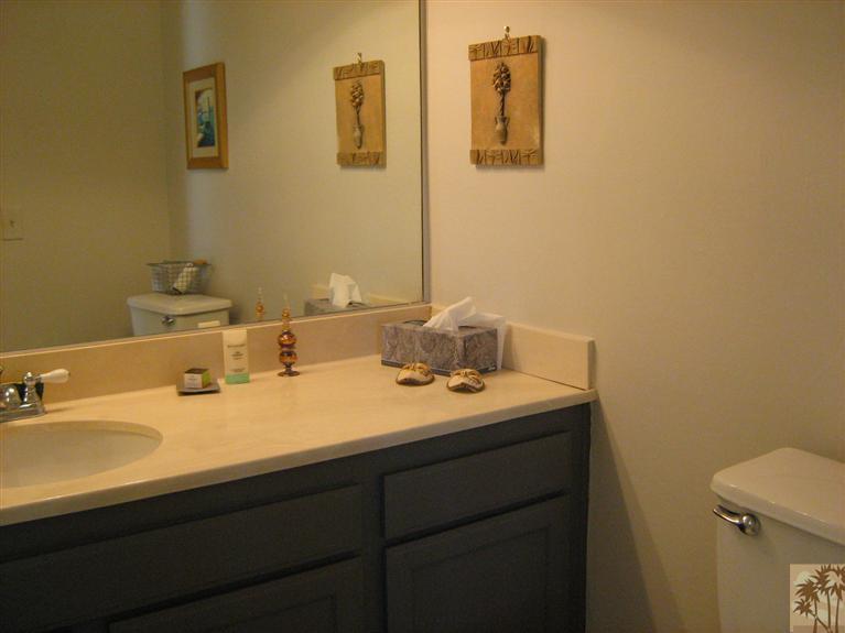 58 Majorca Drive Rancho Mirage, CA 92270 - Photo 16 of 22 a bathroom with a sink and a mirror