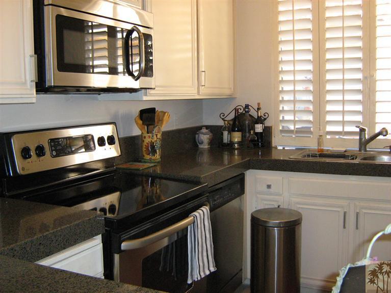 58 Majorca Drive Rancho Mirage, CA 92270 - Photo 10 of 22 a kitchen with a sink cabinets and window