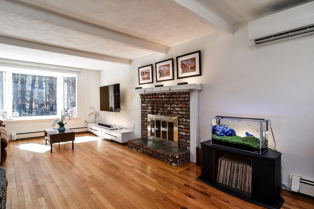 248 Liberty Square Road Boxborough, MA 01719 - Photo 13 of 31 a living room with furniture fireplace and flat screen tv