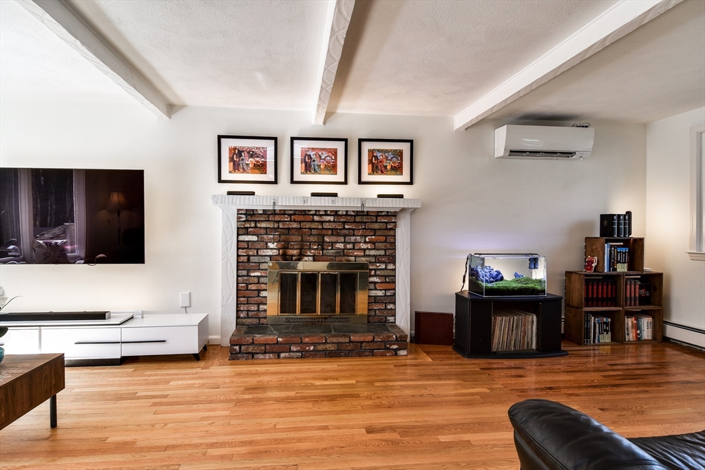 248 Liberty Square Road Boxborough, MA 01719 - Photo 14 of 31 a living room with furniture and a fireplace