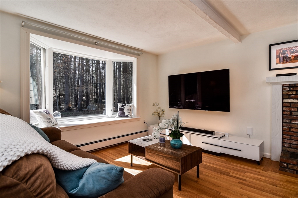 248 Liberty Square Road Boxborough, MA 01719 - Photo 15 of 31 a living room with furniture and a flat screen tv