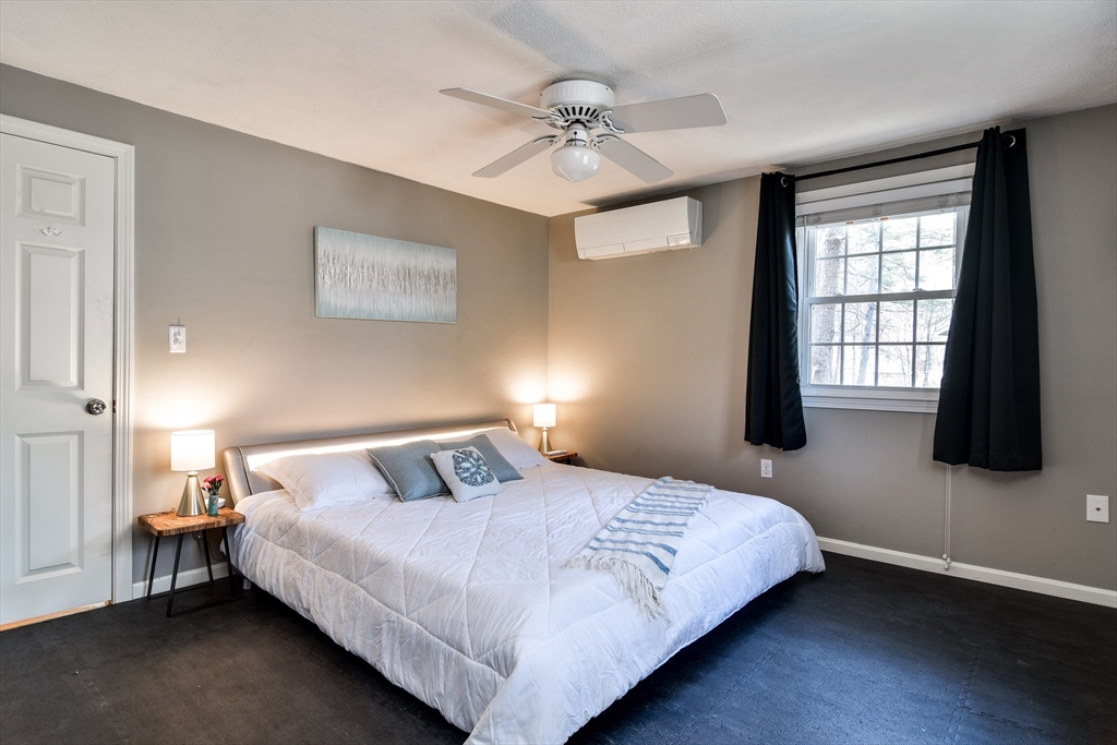 248 Liberty Square Road Boxborough, MA 01719 - Photo 18 of 31 a bedroom with a bed and a window