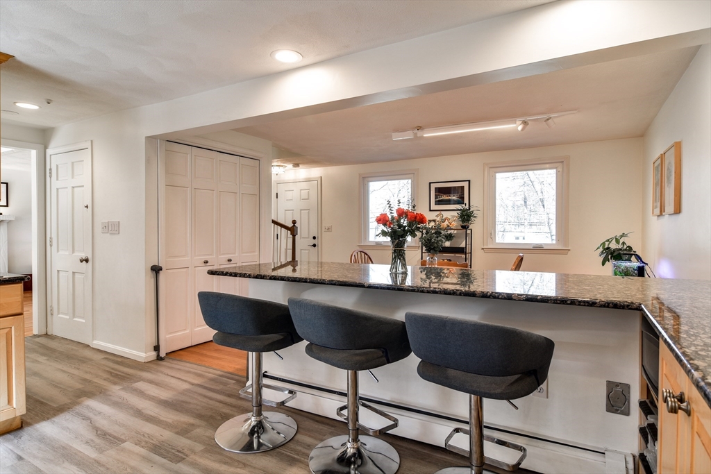 248 Liberty Square Road Boxborough, MA 01719 - Photo 2 of 31 a kitchen with a sink cabinets and wooden floor