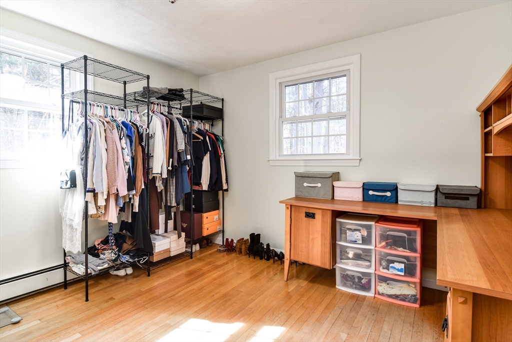 248 Liberty Square Road Boxborough, MA 01719 - Photo 21 of 31 a view of a workspace with furniture and a window