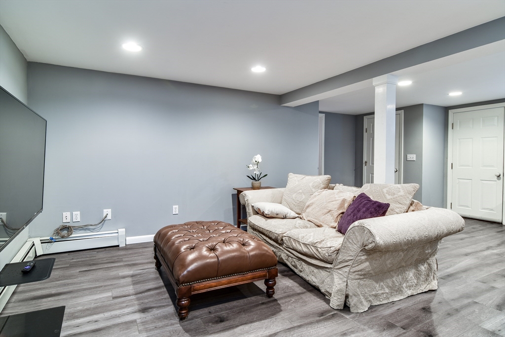 248 Liberty Square Road Boxborough, MA 01719 - Photo 24 of 31 a bedroom with a bed and a couch