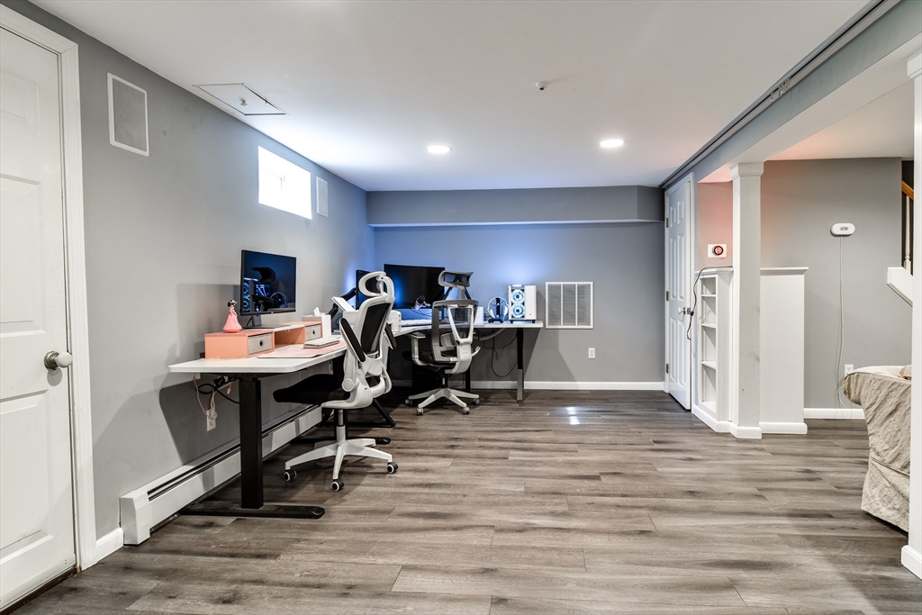 248 Liberty Square Road Boxborough, MA 01719 - Photo 25 of 31 a view of a workspace with furniture and wooden floor