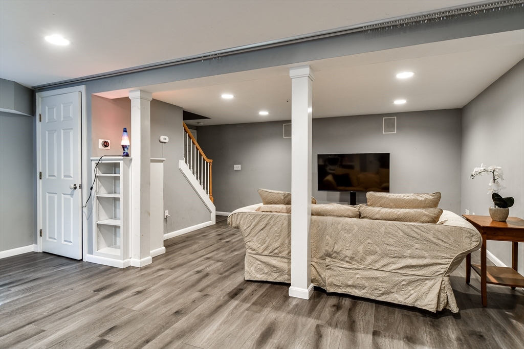 248 Liberty Square Road Boxborough, MA 01719 - Photo 26 of 31 a living room with furniture and a flat screen tv
