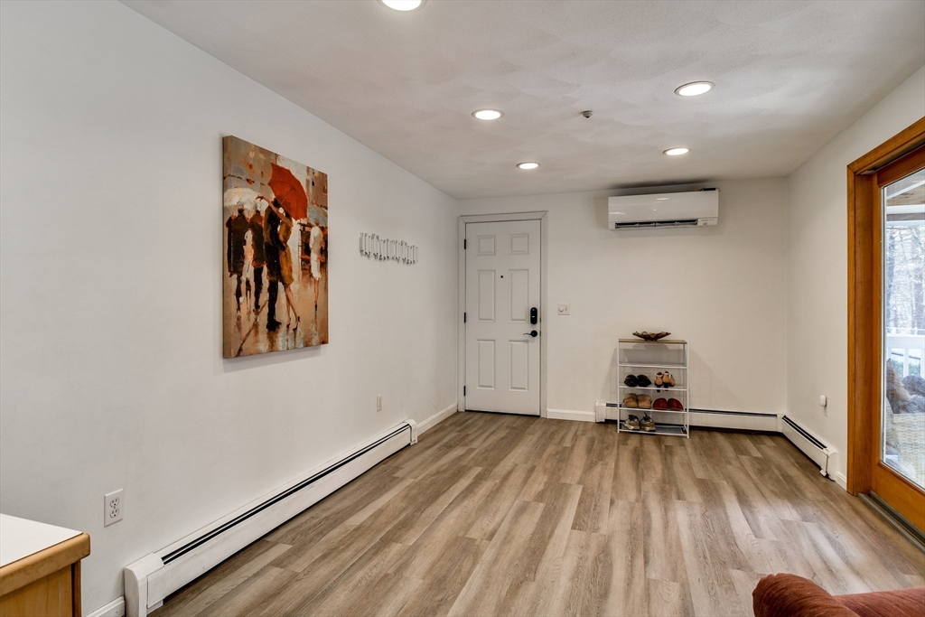248 Liberty Square Road Boxborough, MA 01719 - Photo 6 of 31 a view of a room with gym equipment and a large window