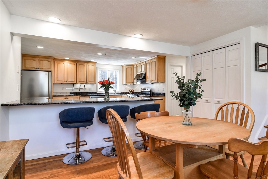 248 Liberty Square Road Boxborough, MA 01719 - Photo 9 of 31 a kitchen with a table and chairs in it