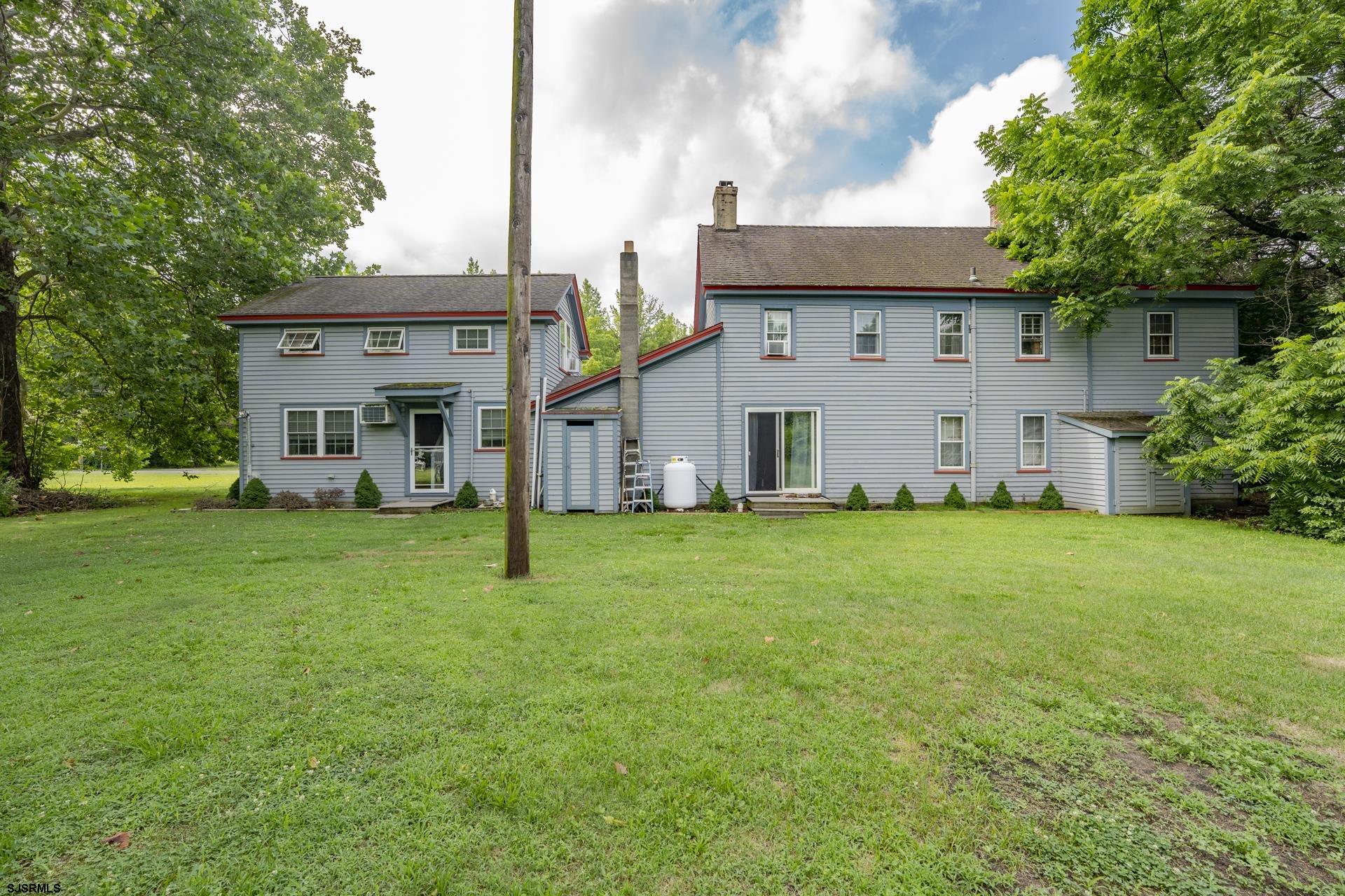 126 Buck Hill Road Corbin City, NJ 08270 - Photo 5 of 10 a view of a house with a yard