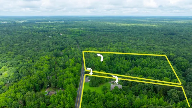 a view of outdoor space with deck and yard