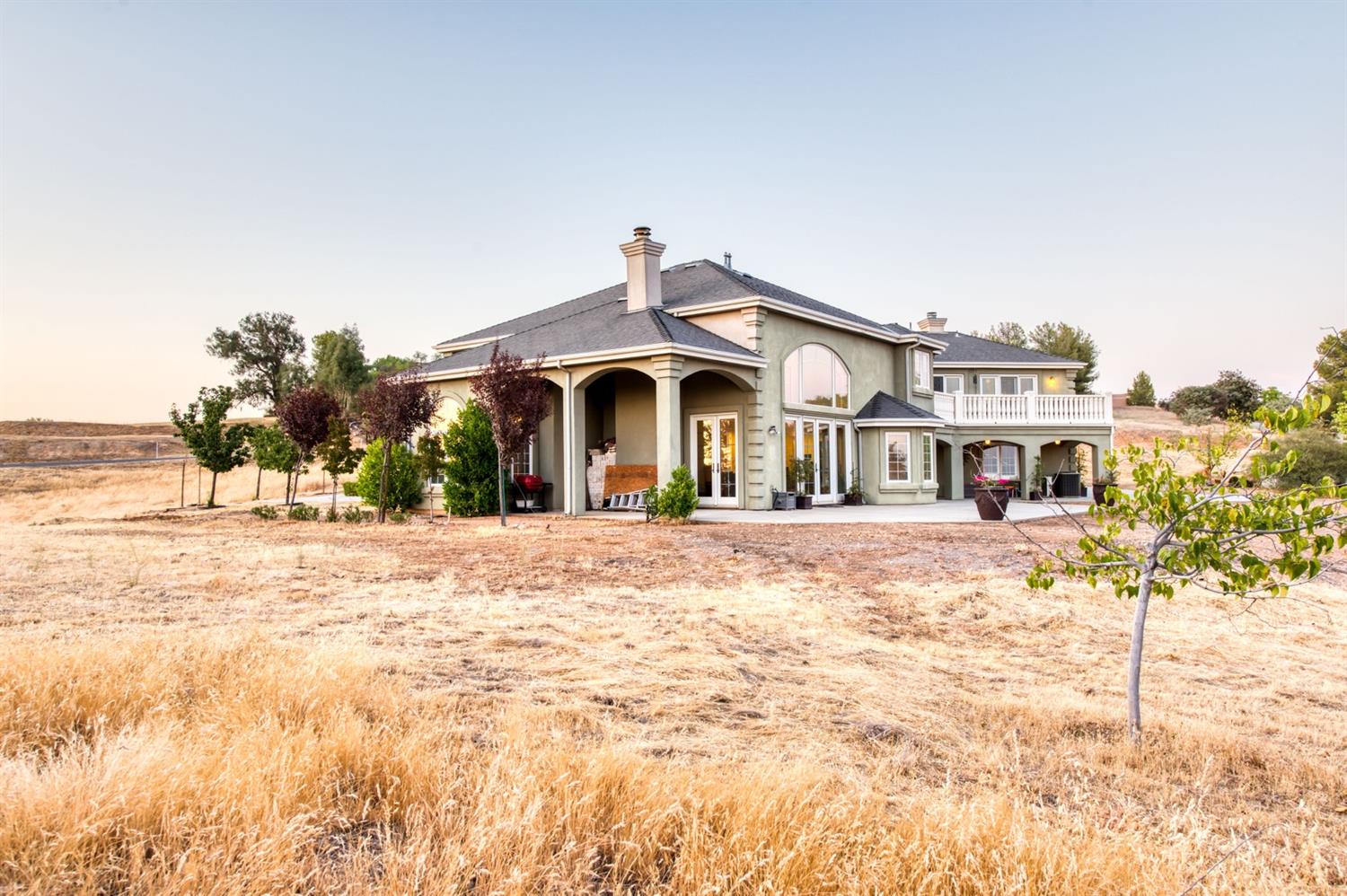 14374 Killarney Drive Madera, CA 93636 - Photo 17 of 56 a front view of a house with a yard