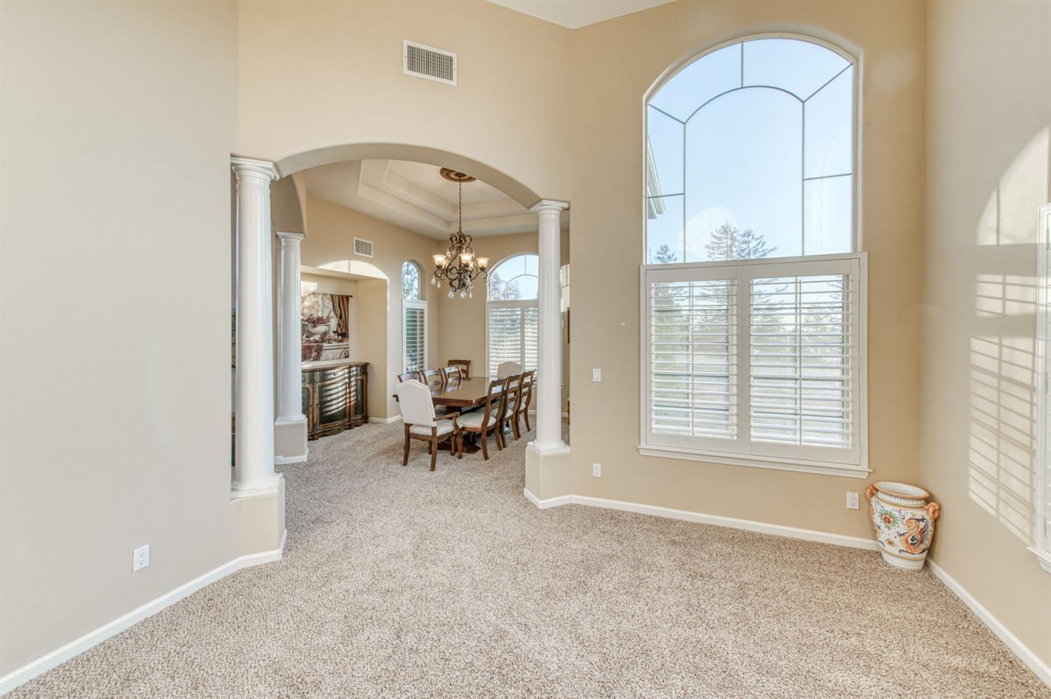 14374 Killarney Drive Madera, CA 93636 - Photo 26 of 56 a view of an empty room with a birdcage and a window
